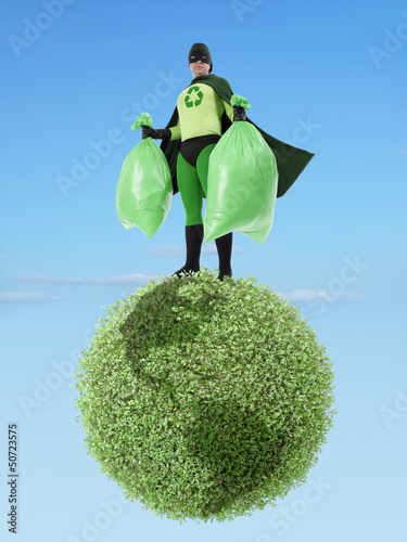 Photo: Eco superhero and garbage free planet Eco superhero and garbage free planet