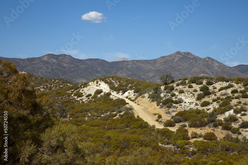 Photo: Dirt road with background view of desert mountains Dirt road with background view of desert mountains