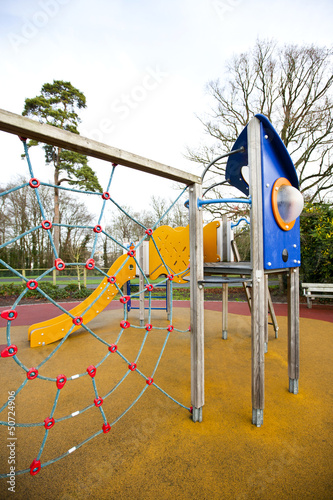 Photo: Climbing web with slide in background Climbing web with slide in background