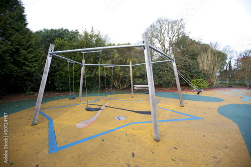 Photo: Swing set in a playground Swing set in a playground