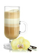 Fragrant coffee latte in glass cup with vanilla pods isolated