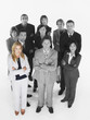 Foto: Portrait of confident business team standing with arms crossed against white background Portrait of confident business team standing with arms crossed against white background