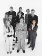 Foto: Portrait of confident business team standing with arms crossed against white background Portrait of confident business team standing with arms crossed against white background