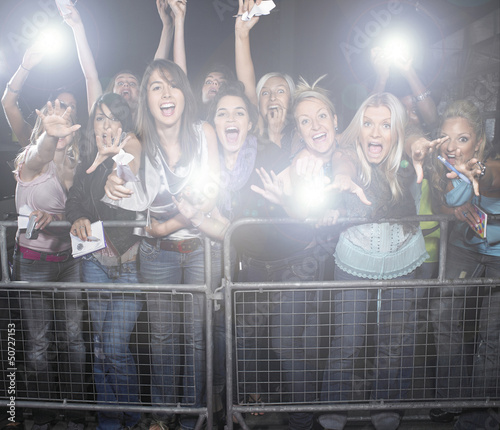 Photo: Crowd of young female fans screaming and cheering at concert Crowd of young female fans screaming and cheering at concert