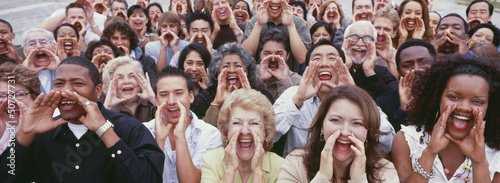 Photo: Panoramic shot of crowd shouting with hands on face Panoramic shot of crowd shouting with hands on face