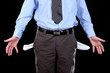 Business man showing his empty pockets, on black background