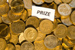 Prize sign at a stack of golden coins