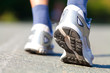 Running shoes on runner