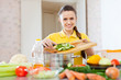  woman cooking  vegetables at  kitchen