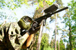 Photo: paintball player holding fire paintball player holding fire