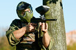 Photo: paintball player holding fire paintball player holding fire