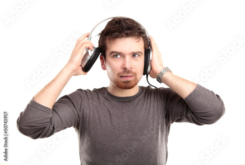 Photo: surprised young man in headphone surprised young man in headphone
