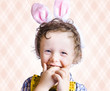 Child Eating Chocolate Easter Egg With Smile