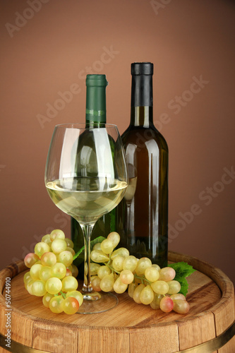 Photo: Composition of wine bottles, glass of white wine, grape Composition of wine bottles, glass of white wine, grape