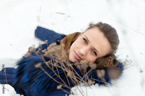 Photo: Girl lying on snow Girl lying on snow