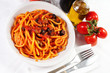 pasta with olives, bacon and sauce