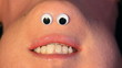 Mrs Chinigan talks.  Cartoon eyes on inverted female face.