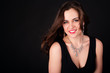 Photo: Beautiful young woman in evening dress with necklace Beautiful young woman in evening dress with necklace
