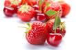 Red cherry with strawberry on white