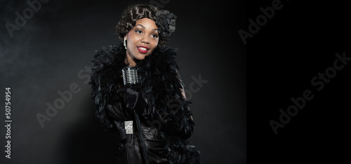 Photo: Vintage jazz woman singing. Black african american. Copy space. Vintage jazz woman singing. Black african american. Copy space.