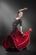 Photo: young woman dancing flamenco on black young woman dancing flamenco on black