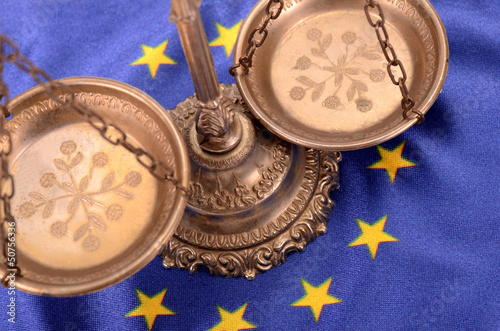 Photo: Scales of justice and Flag of European union Scales of justice and Flag of European union
