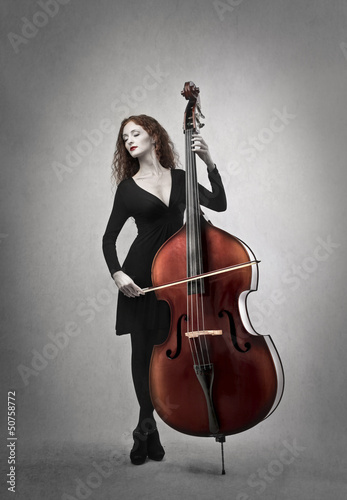 Photo: woman playing contrabbass woman playing contrabbass