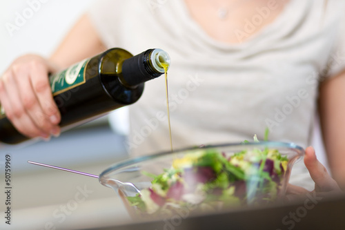 Photo: Woman preparing a salad Woman preparing a salad