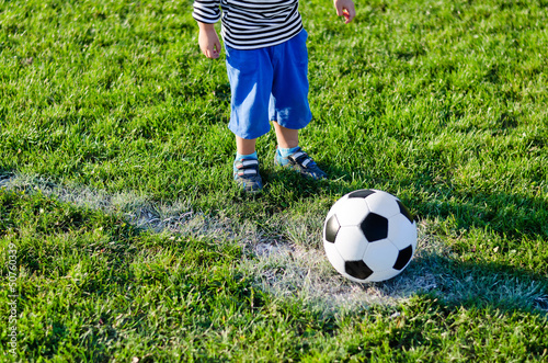 Photo: Little child about to kick off Little child about to kick off