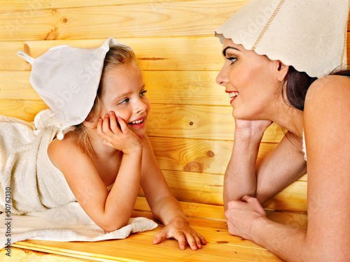 Photo: Family with child relaxing at sauna. Family with child relaxing at sauna.