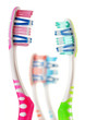 Composition with toothbrushes isolated on white