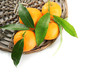 Ripe sweet tangerine with leaves, isolated on white