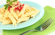Rigatoni pasta dish with tomato sauce close up