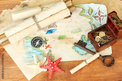 Photo: map of treasures on wooden background map of treasures on wooden background