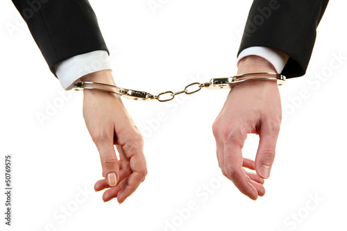 Photo: Man and woman hands and breaking handcuffs isolated Man and woman hands and breaking handcuffs isolated