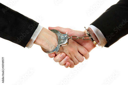 Photo: Man and woman hands and breaking handcuffs isolated Man and woman hands and breaking handcuffs isolated