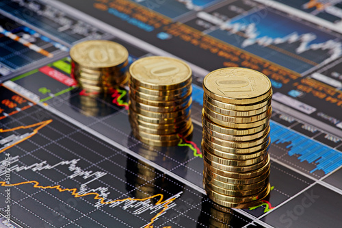 Photo: Uptrend stacks coins,on the financial stock charts as backgrou Uptrend stacks coins,on the financial stock charts as backgrou
