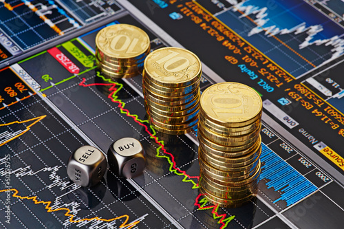 Photo: Dices cubes with the words SELL BUY, uptrend stacks of golden Dices cubes with the words SELL BUY, uptrend stacks of golden