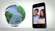 Video of couples presented on smartphone beside globe