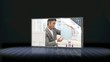 Businessman looking at globe and couple packing suitcase