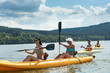 Young students kayaking in the sunshine