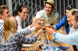 Foto: Group of cheerful people toasting with drinks Group of cheerful people toasting with drinks