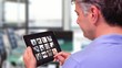 Video: Man using tablet to view business people at work Man using tablet to view business people at work