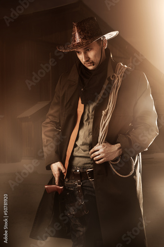 Photo: handsome man in cowboy clothes handsome man in cowboy clothes