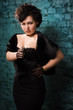 Foto: Fashionable women in a black shoots a gun Fashionable women in a black shoots a gun