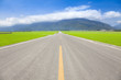 Photo: the road pass trough green rice field. taitung.taiwan. the road pass trough green rice field. taitung.taiwan.