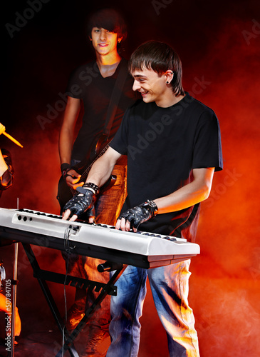 Photo: Band playing musical instrument. Band playing musical instrument.