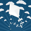 Kite on a blue background with clouds and rays