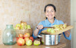  woman cooks applesauce jam