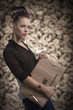 fashion brunette with bag turned of three quarters